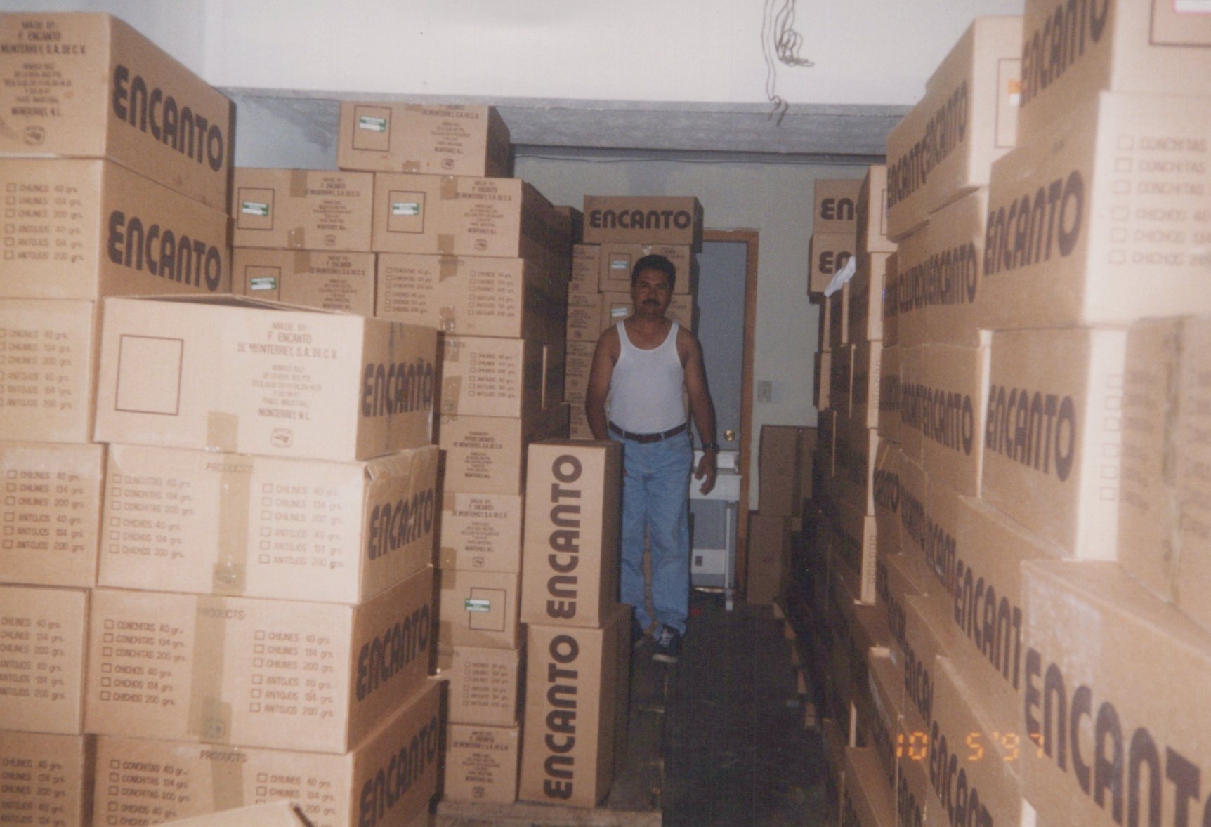 Rafael Parra in the garage with products